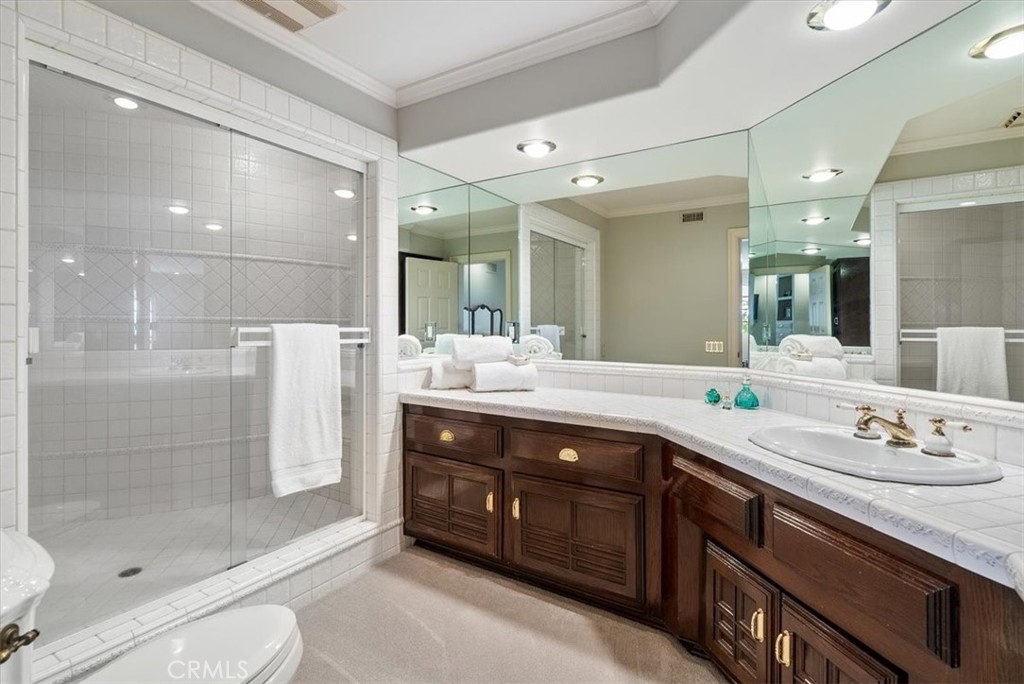 8283 Cross Canyons Road San Miguel, CA 93451 - Photo 45 of 73 a spacious bathroom with a shower sink and mirror