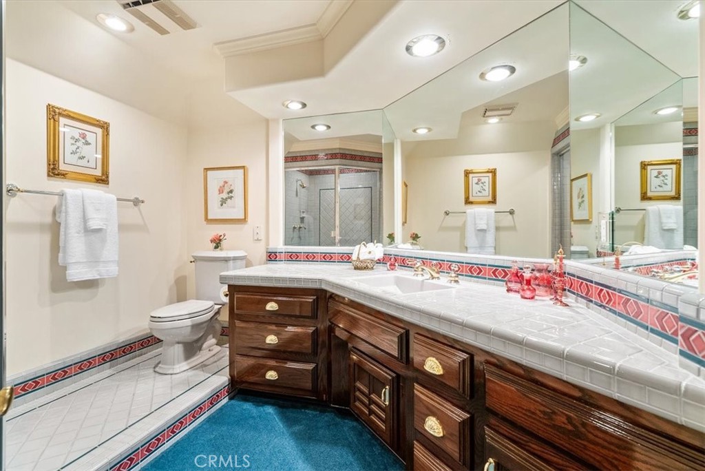 8283 Cross Canyons Road San Miguel, CA 93451 - Photo 50 of 73 a bathroom with a sink a toilet and a large mirror