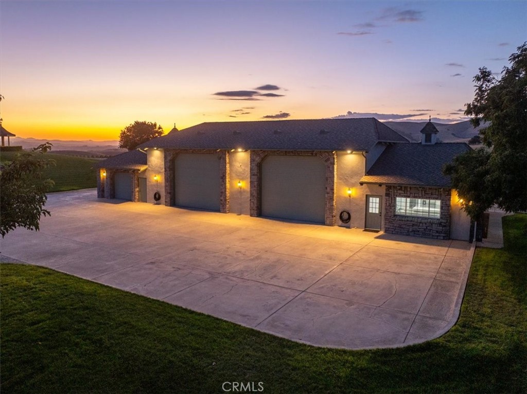 8283 Cross Canyons Road San Miguel, CA 93451 - Photo 6 of 73 a front view of a house with a yard and garage