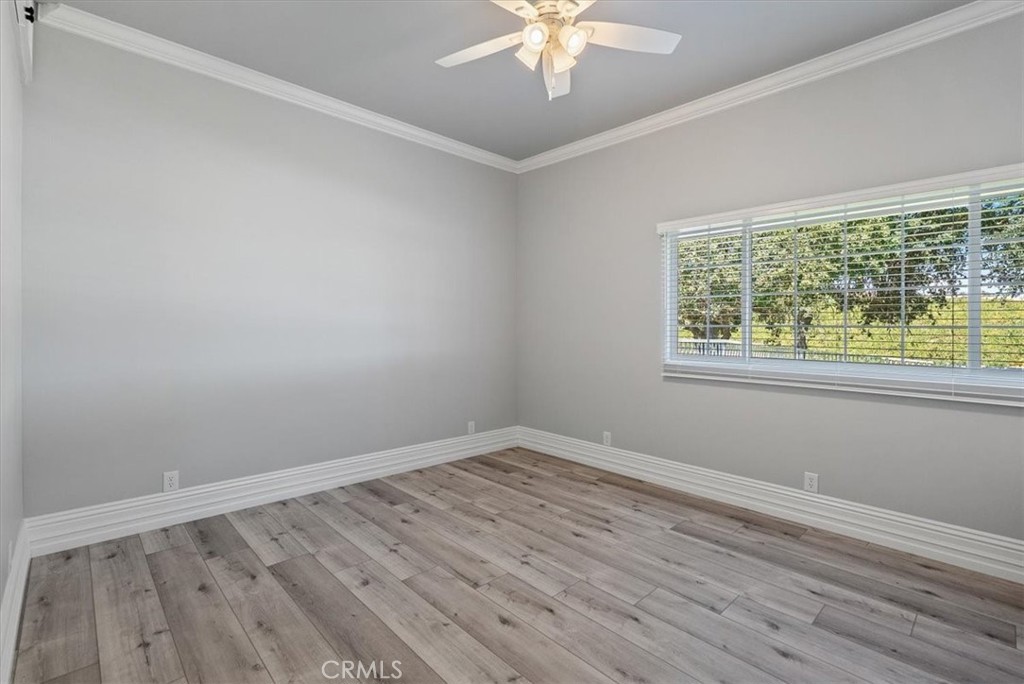 8283 Cross Canyons Road San Miguel, CA 93451 - Photo 65 of 73 a view of an empty room with wooden floor and a window