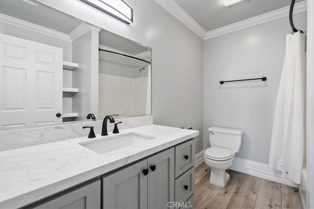 8283 Cross Canyons Road San Miguel, CA 93451 - Photo 66 of 73 a bathroom with a granite countertop sink a toilet and a mirror