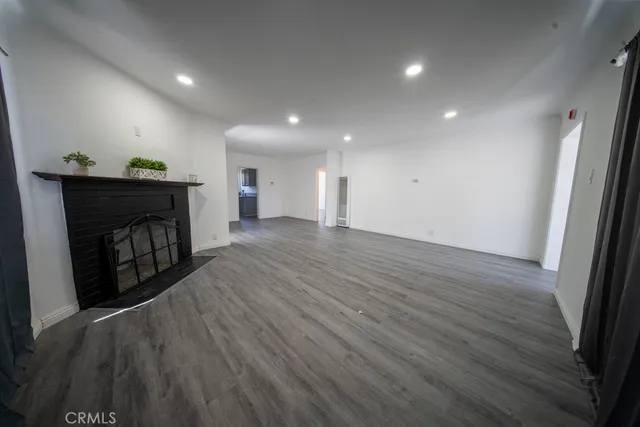 a view of a livingroom with wooden floor