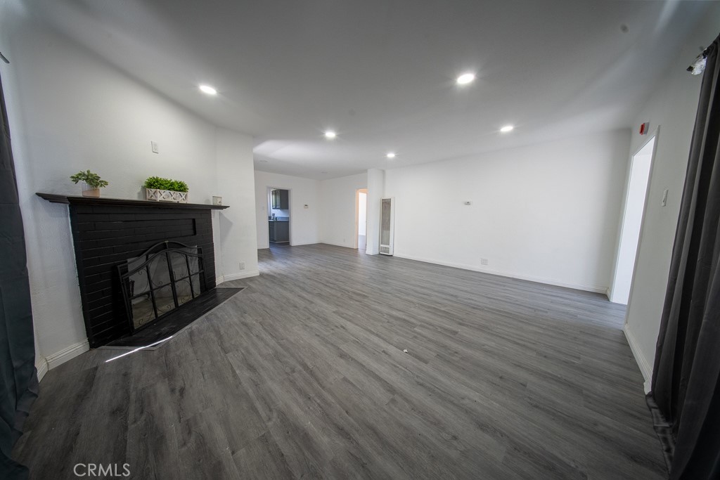 843 West Brazil Street Compton, CA 90220 - Photo 12 of 17 a view of a livingroom with wooden floor