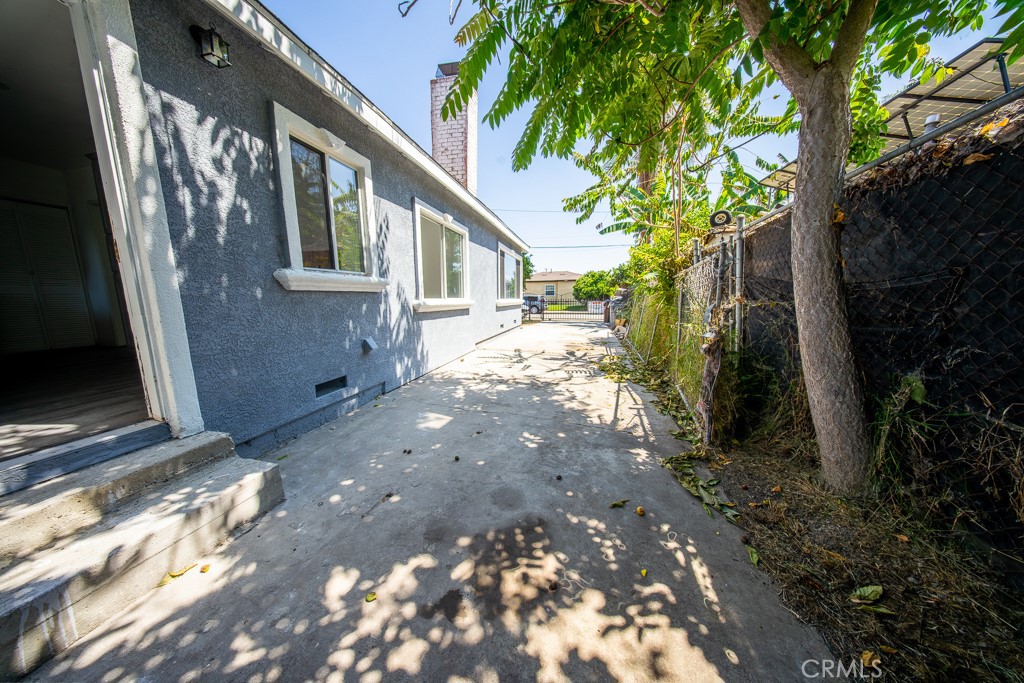 843 West Brazil Street Compton, CA 90220 - Photo 14 of 17 a view of a house with a yard