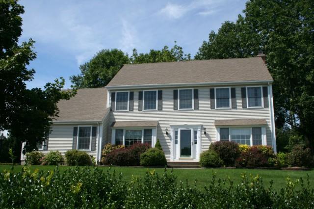 10 Howes Court Ridgefield, CT 06877 - Photo 1 of 1 a front view of a house with a yard