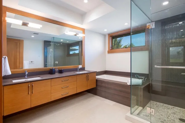 a bathroom with a double vanity sink and a bathtub