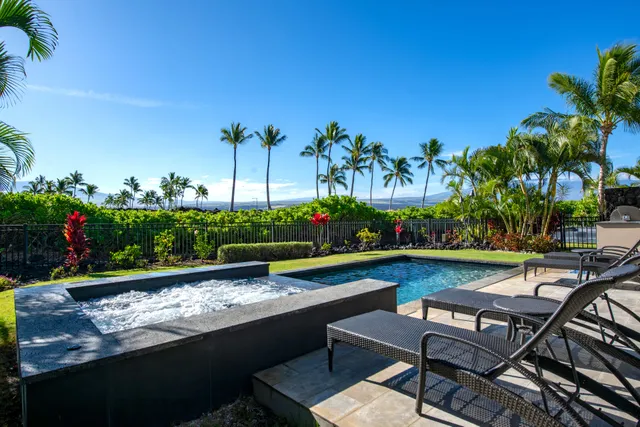 a view of swimming pool with outdoor seating and plants