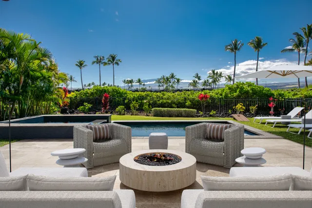 a view of a patio with couches and potted plants
