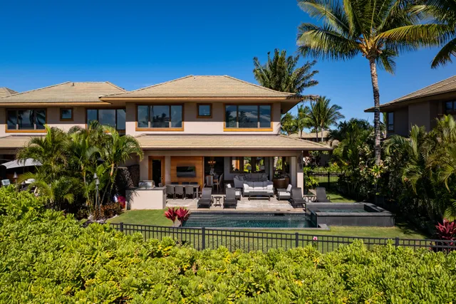 a view of a house with pool porch and sitting area