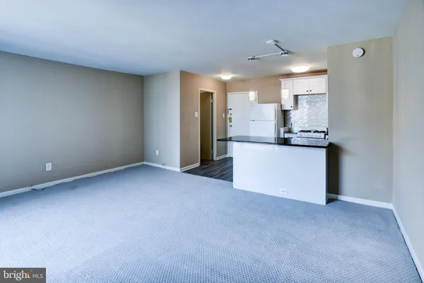a view of a kitchen with a sink