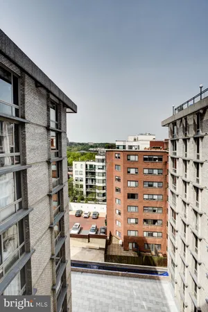 a view of a walk in closet with living room