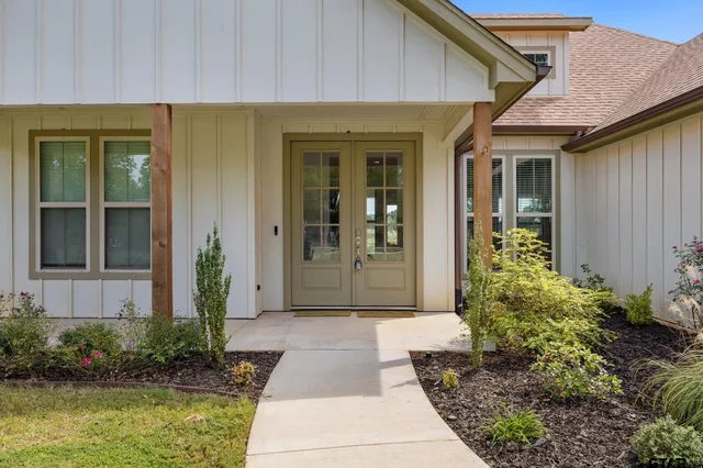 a front view of a house having garden