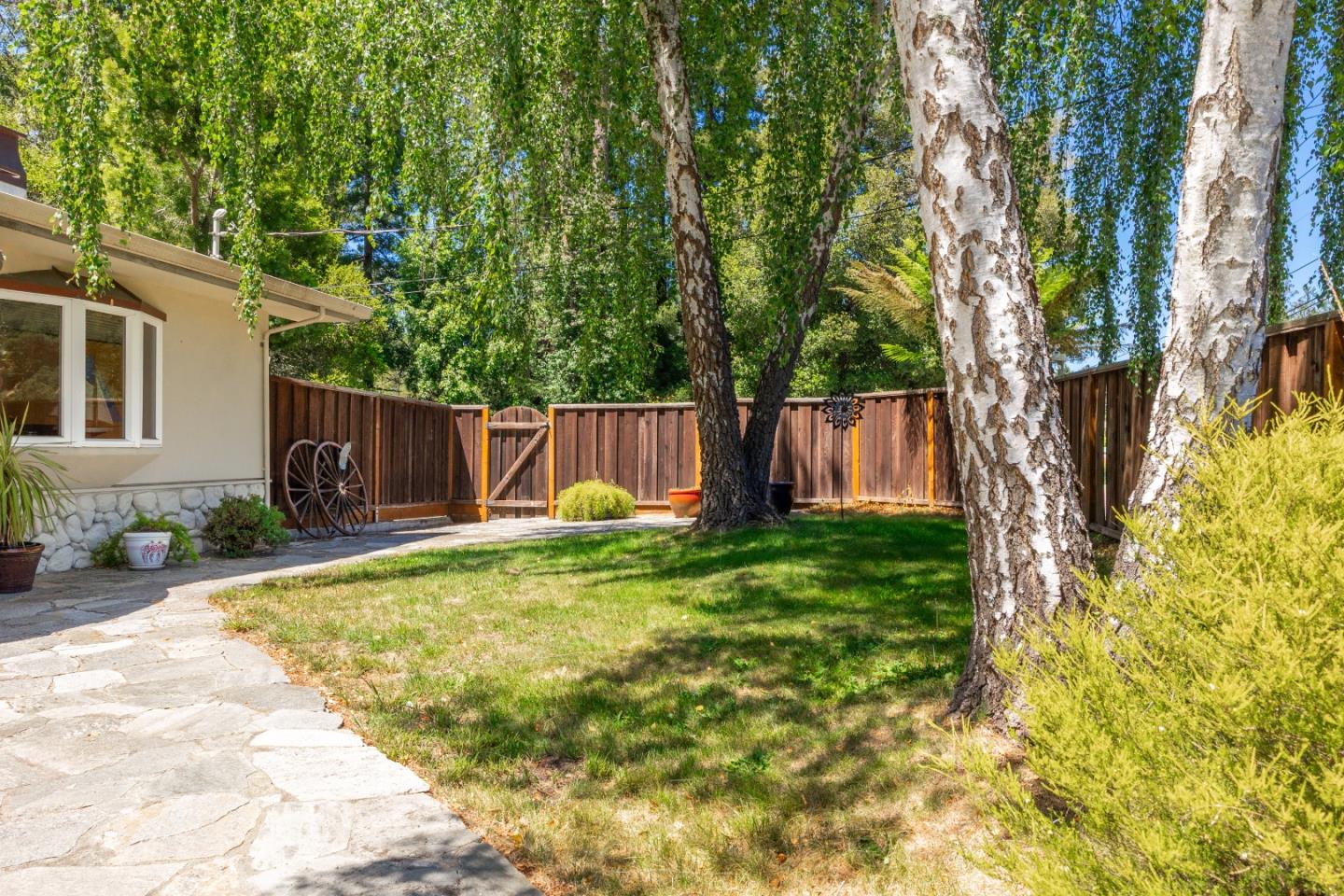 2000 Glen Canyon Road Santa Cruz, CA 95060 - Photo 4 of 41 a view of a backyard with a garden and tree