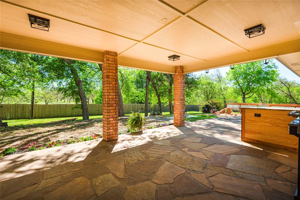 2020 Arbor Bend Road Bonham, TX 75418 - Photo 32 of 40 Fenced backyard featuring a patio area