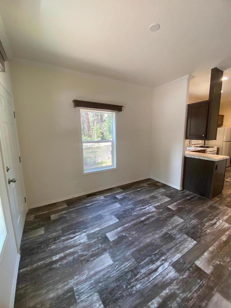 6165 Pony Express Trail, Unit 32 Pollock Pines, CA 95726 - Photo 6 of 7 a view of a kitchen with wooden floor and electronic appliances