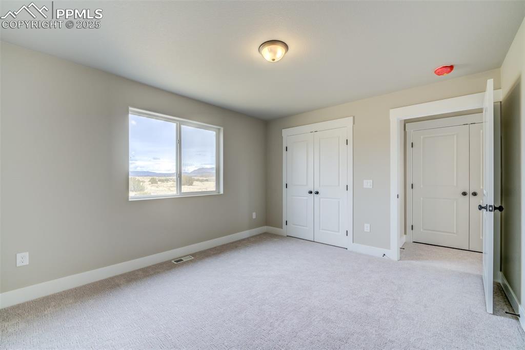 205 High Meadows Drive Florence, CO 81226 - Photo 16 of 28 a view of an empty room with a window
