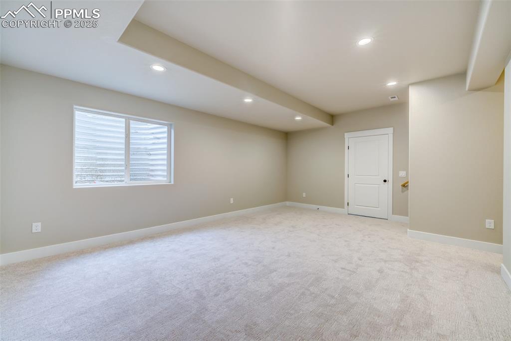 205 High Meadows Drive Florence, CO 81226 - Photo 24 of 28 an empty room with windows