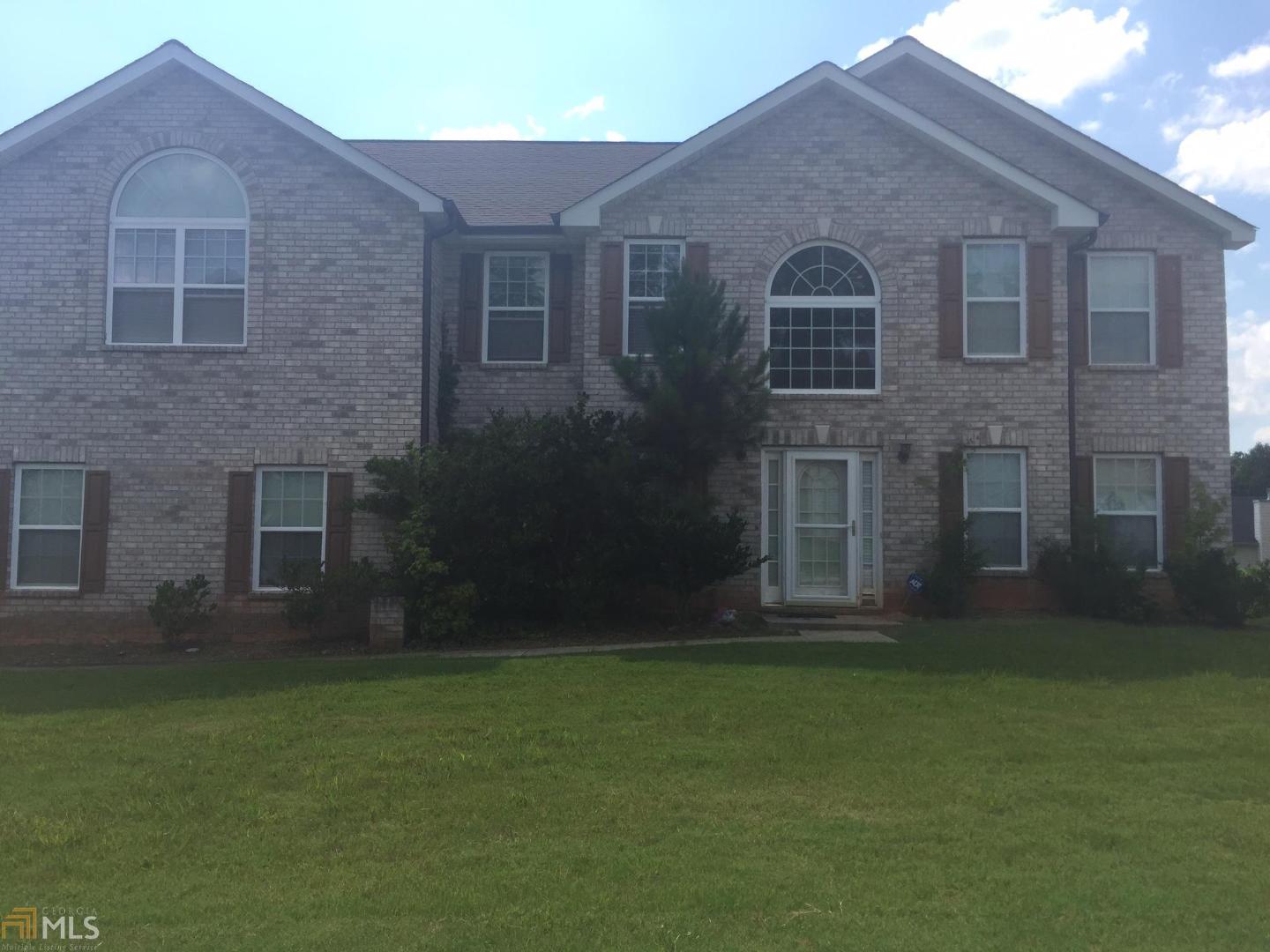 6239 Shell Drive Southwest Atlanta, GA 30331 - Photo 1 of 1 a brick house with a yard