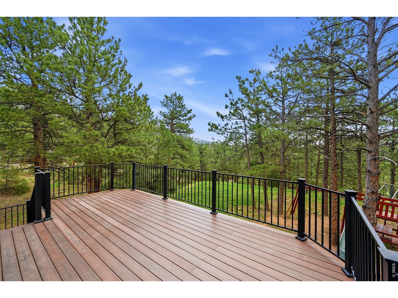 256 Choctaw Road Lyons, CO 80540 - Photo 44 of 50 a view of balcony with wooden floor and fence