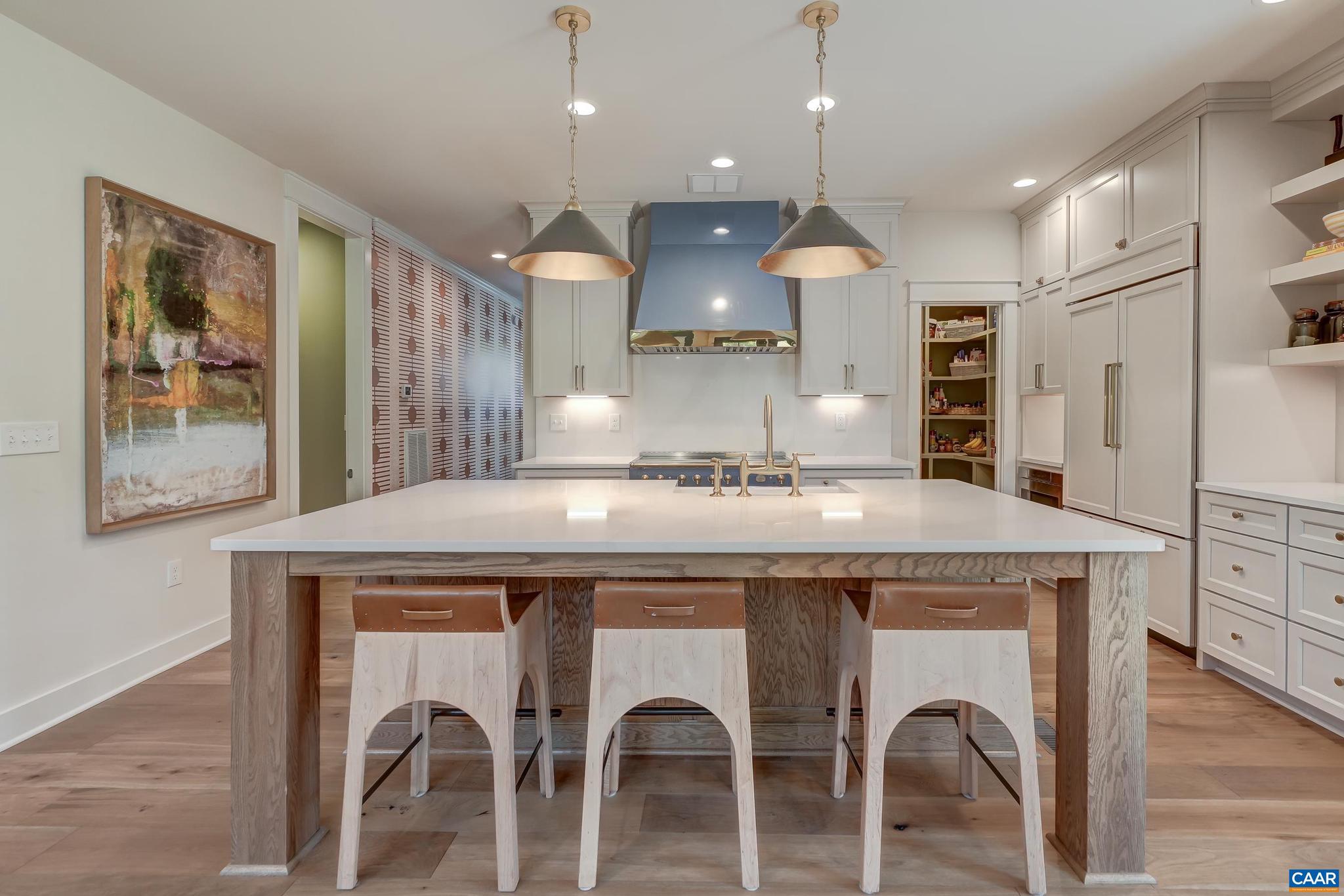 3327 Rowcross Street Crozet, VA 22932 - Photo 12 of 63 a kitchen with a table chairs refrigerator and microwave