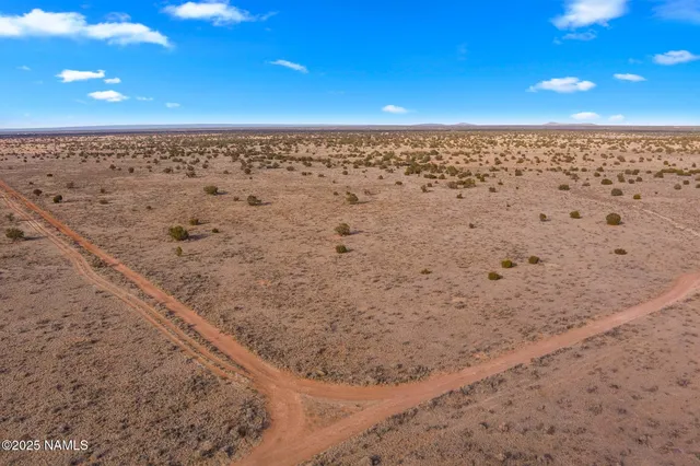 a view of an ocean beach and mountain