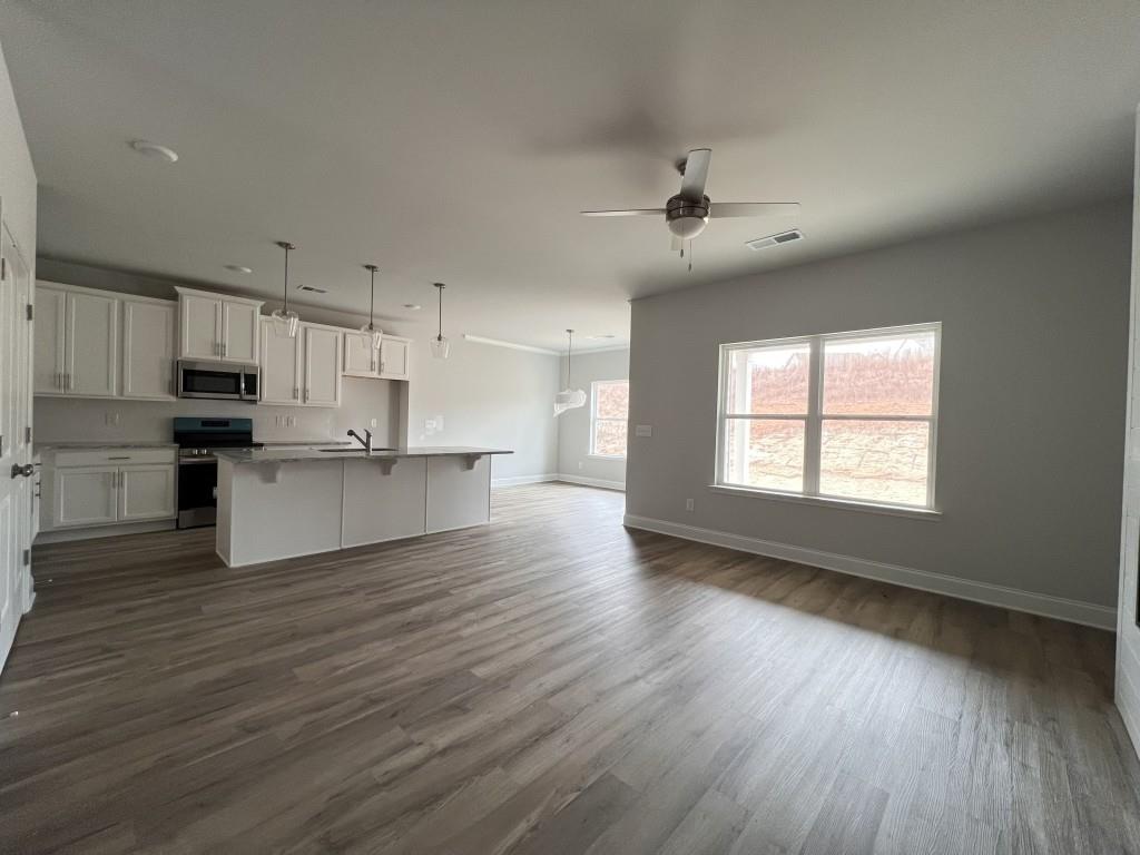 176 Greenview Court Homer, GA 30547 - Photo 2 of 19 a view of kitchen with refrigerator stove microwave and cabinets
