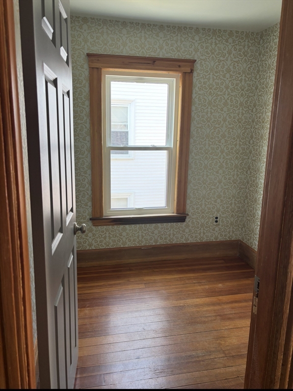 13 Moulton Street Lynn, MA 01905 - Photo 9 of 18 a view of a small space with wooden floor and a window