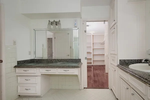a view of cabinets a sink and dishwasher in a kitchen