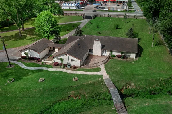 an aerial view of a house with a garden