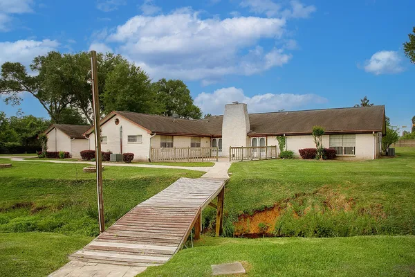 a view of a house with a big yard