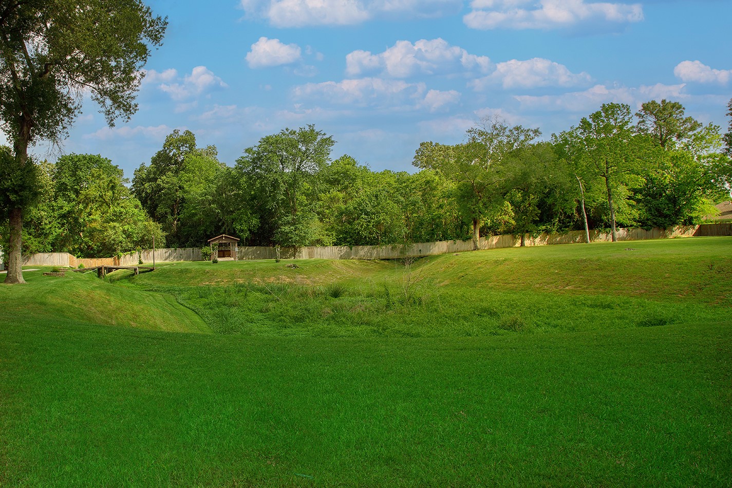 23218 Aldine Westfield Road Spring, TX 77373 - Photo 41 of 47 a view of a green field with trees in the background