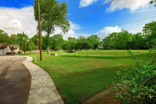 a view of a park with houses