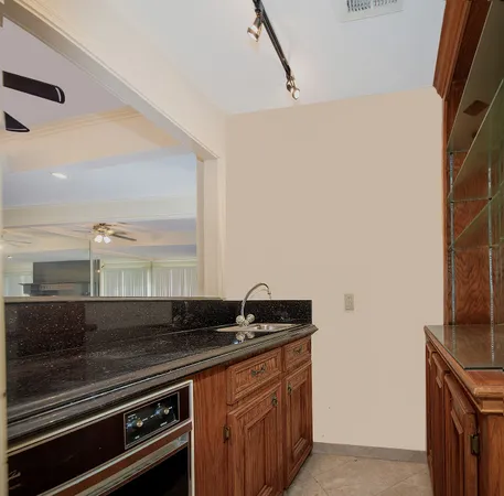 a kitchen with a sink and a stove