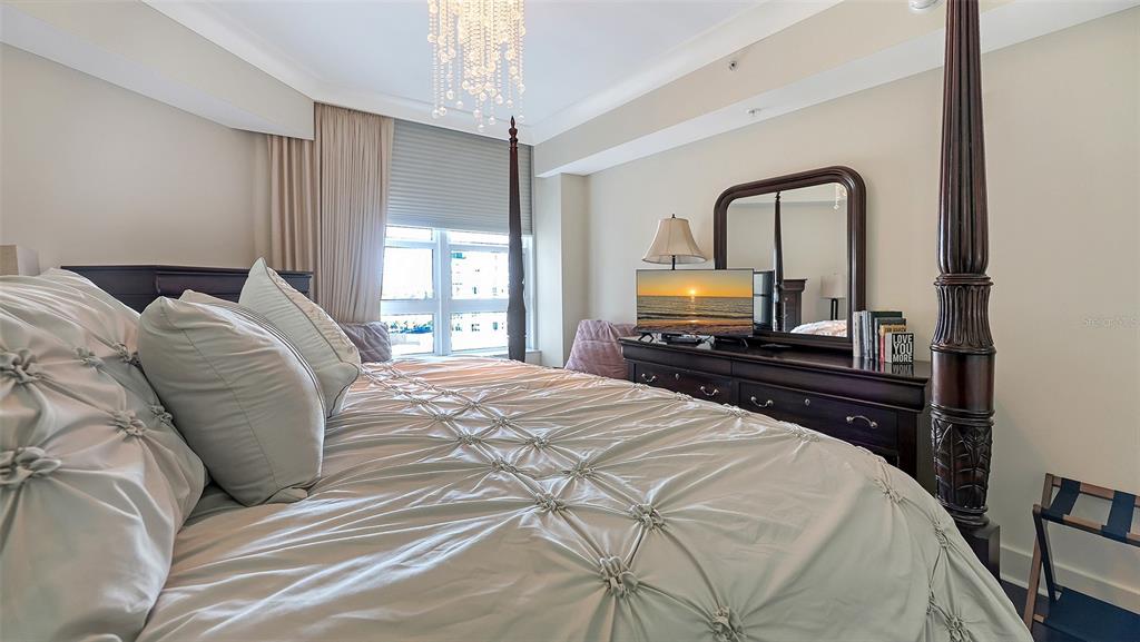 1350 Main Street, Unit 1007 Sarasota, FL 34236 - Photo 16 of 48 a bedroom with a bed and a large window