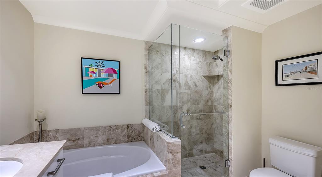 1350 Main Street, Unit 1007 Sarasota, FL 34236 - Photo 18 of 48 a bathroom with a shower a toilet a sink and a shower