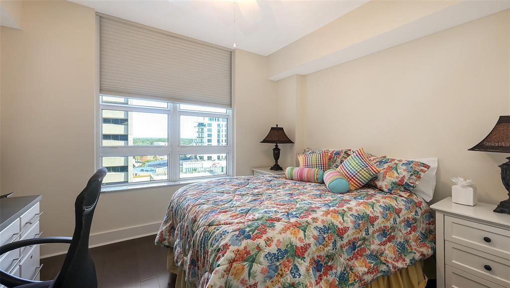 1350 Main Street, Unit 1007 Sarasota, FL 34236 - Photo 20 of 48 a bedroom with a bed and a window