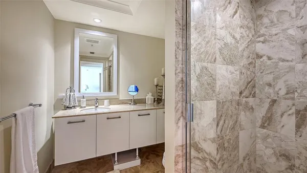a bathroom with a double vanity sink and a mirror