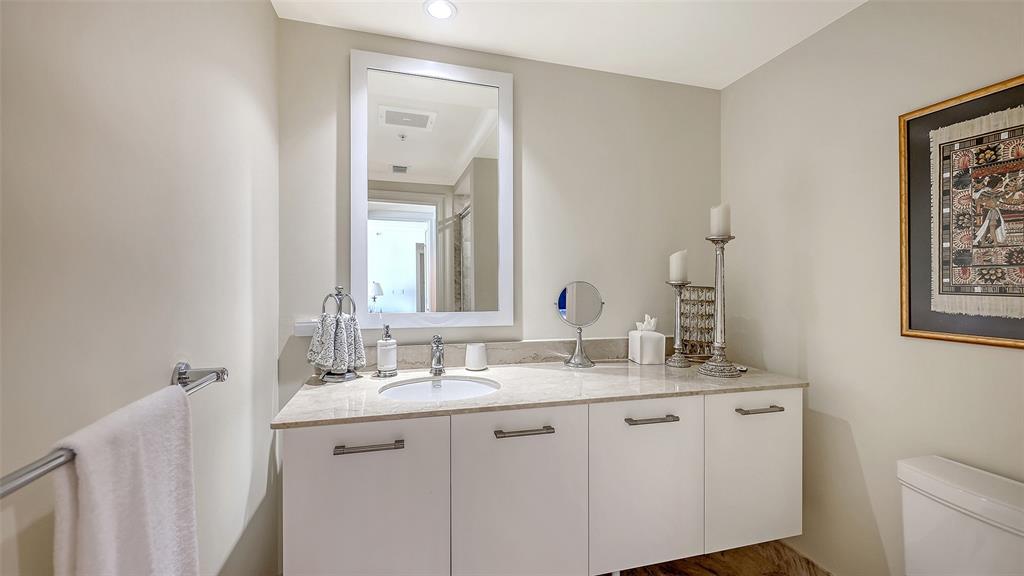 1350 Main Street, Unit 1007 Sarasota, FL 34236 - Photo 24 of 48 a bathroom with a sink and a mirror