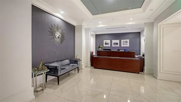 a living room with furniture and a piano