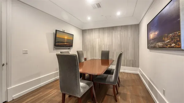 a view of a dining room with furniture window and wooden floor