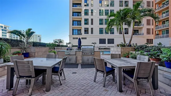 a view of a dining table and chairs in the patio