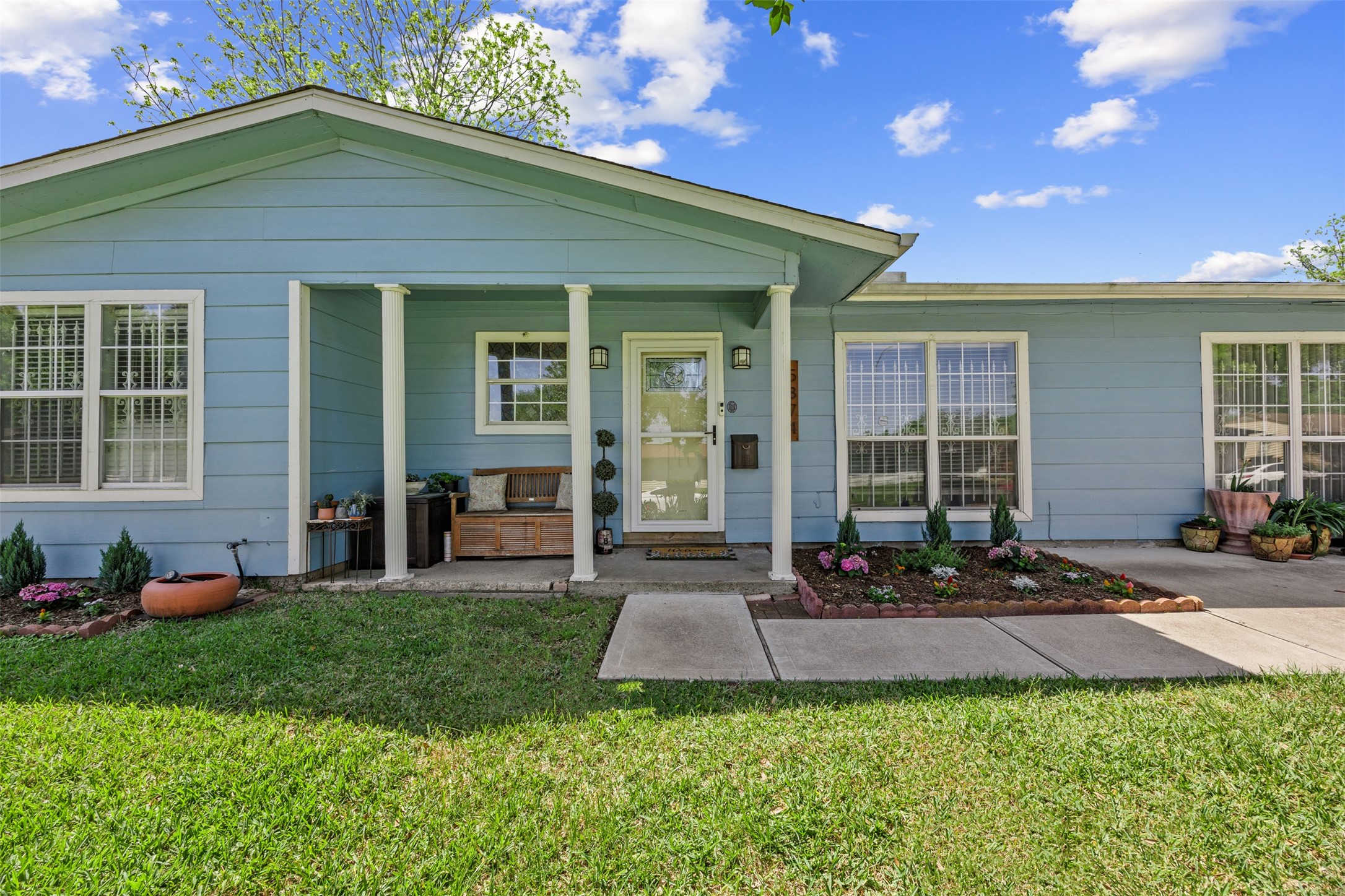 5874 Beldart Street Houston, TX 77033 - Photo 2 of 37 Charming curb appeal welcomes you home with a clean, inviting exterior and private driveway.