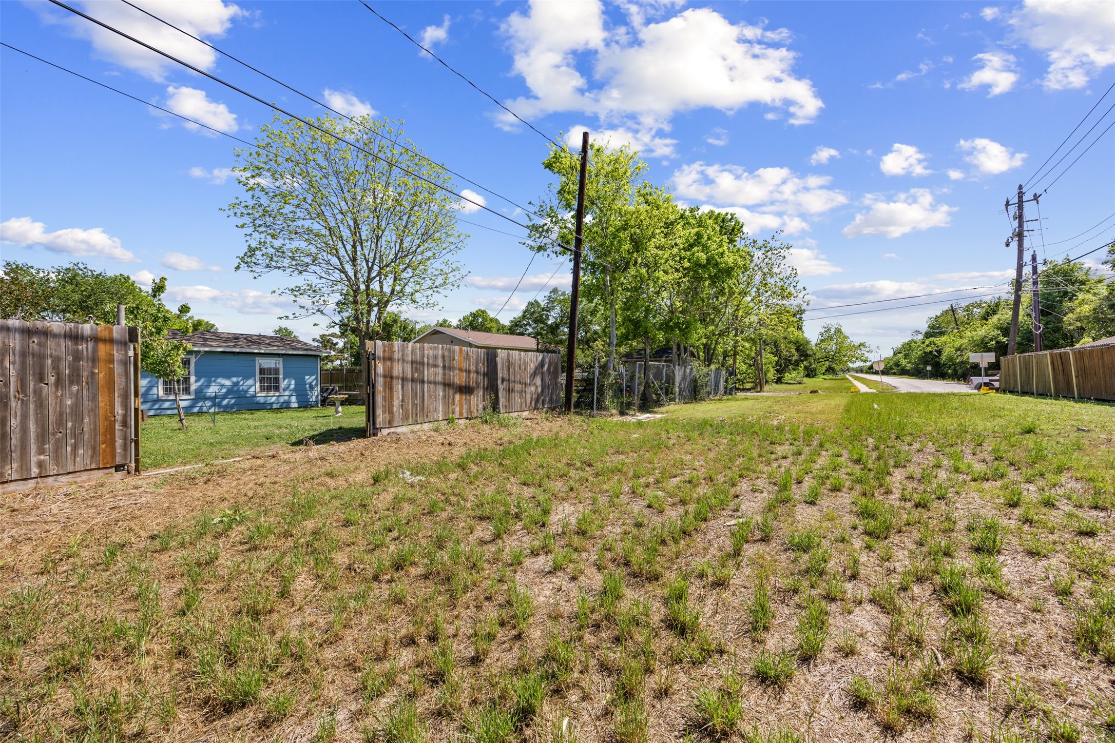 5874 Beldart Street Houston, TX 77033 - Photo 24 of 37 Backs to a large easement with no direct rear neighbors, offering added privacy and open space.