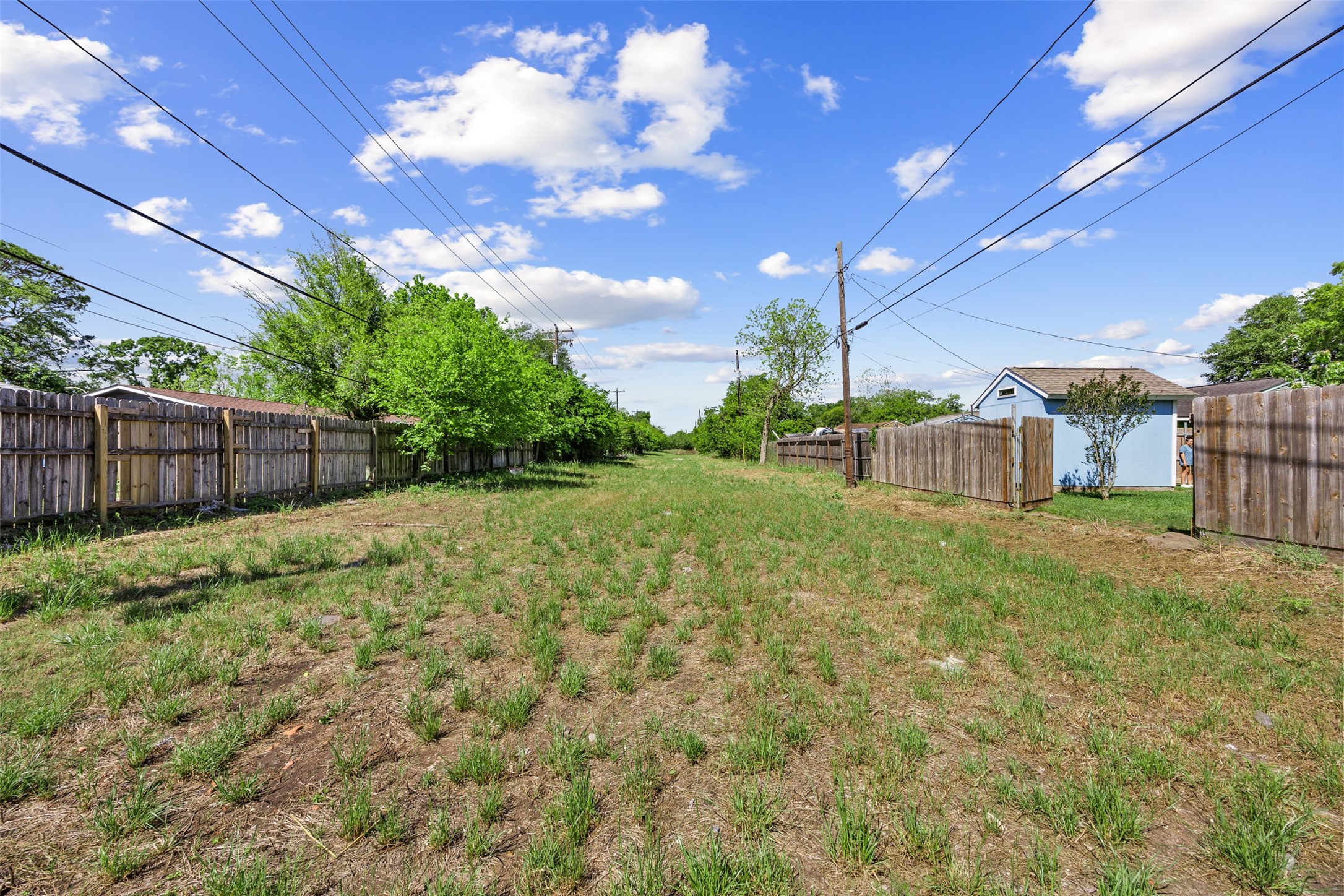 5874 Beldart Street Houston, TX 77033 - Photo 25 of 37 Well-maintained easement behind the home offers added open space and privacy.