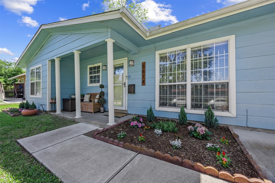 5874 Beldart Street Houston, TX 77033 - Photo 3 of 37 The inviting front porch creates a warm first impression and a peaceful spot to enjoy the outdoors.
