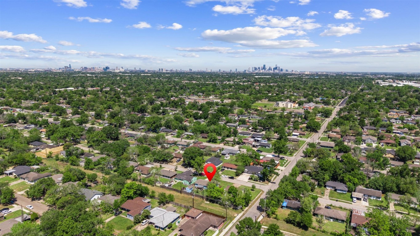 5874 Beldart Street Houston, TX 77033 - Photo 34 of 37 Aerial view looking north, with the Medical Center and Downtown Houston visible in the distance.