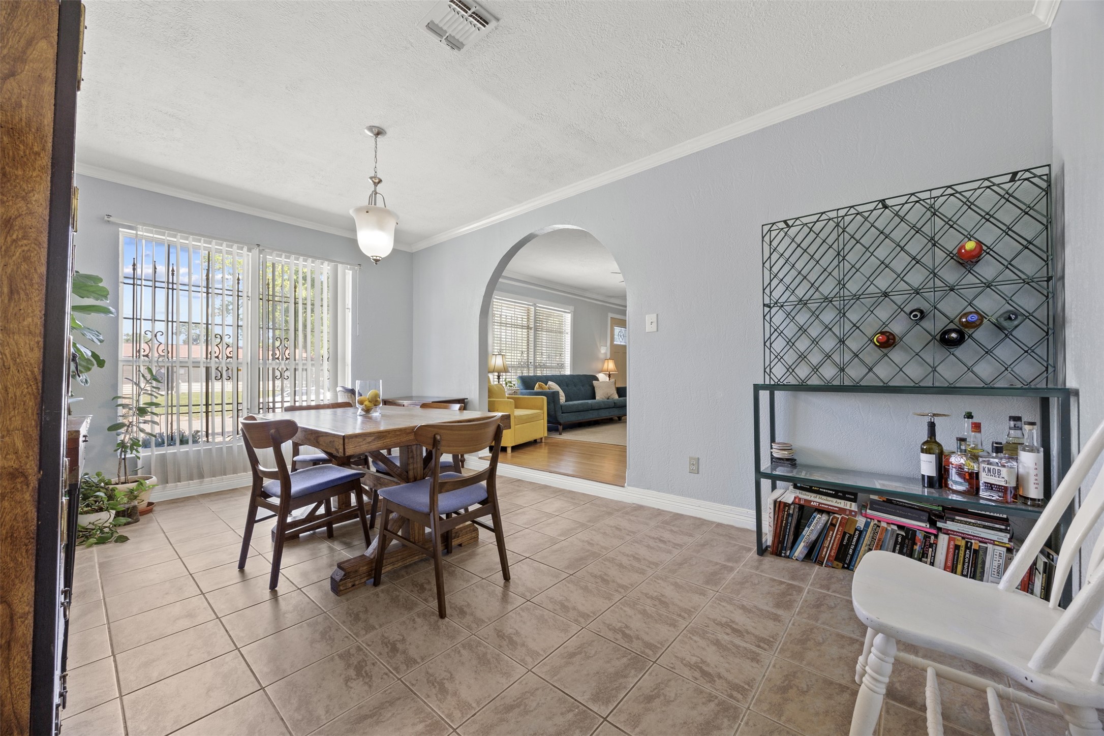 5874 Beldart Street Houston, TX 77033 - Photo 7 of 37 Dining room with open sightlines and a seamless connection to the living area.