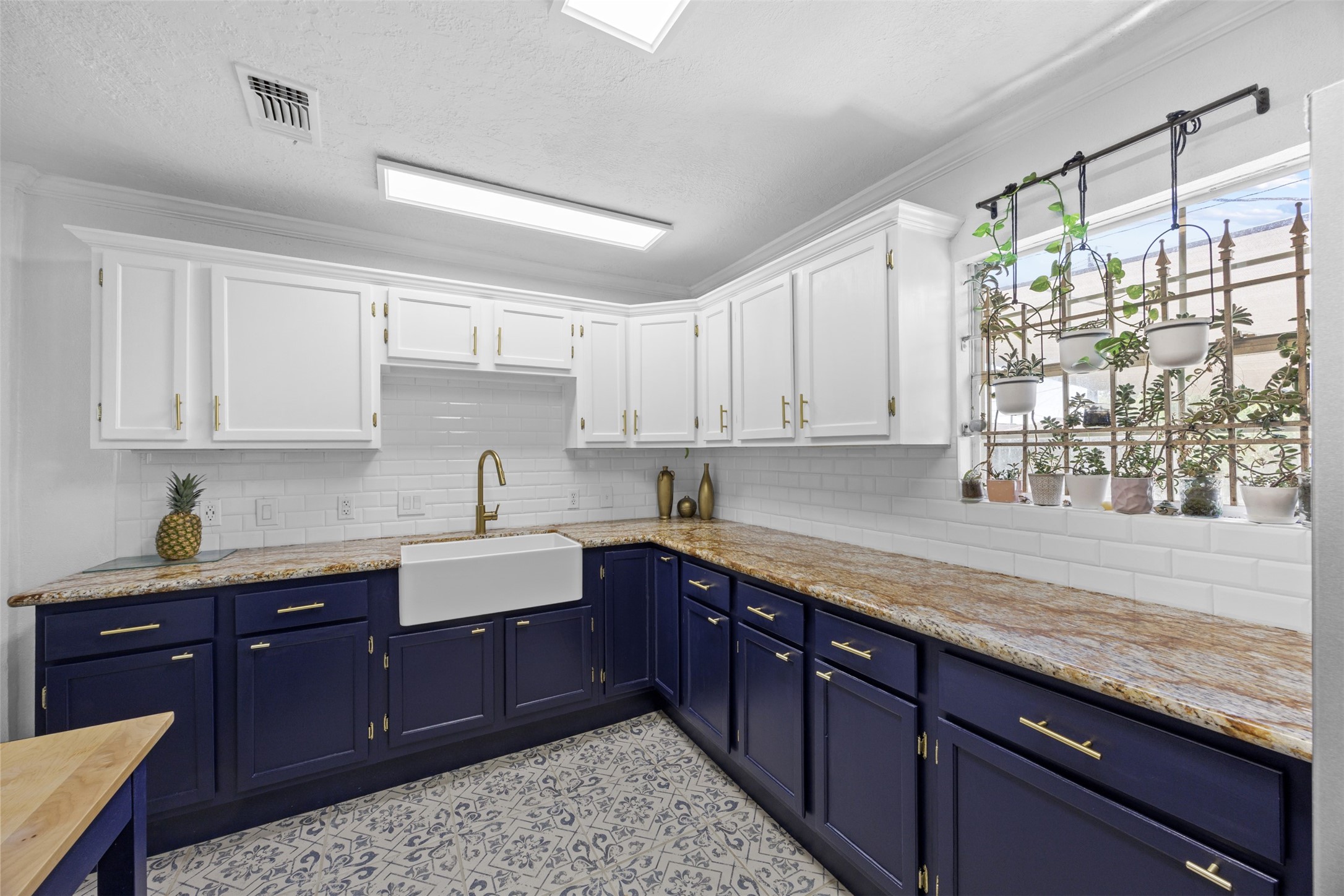 5874 Beldart Street Houston, TX 77033 - Photo 10 of 37 Bright kitchen with window light that makes the space feel open and inviting.