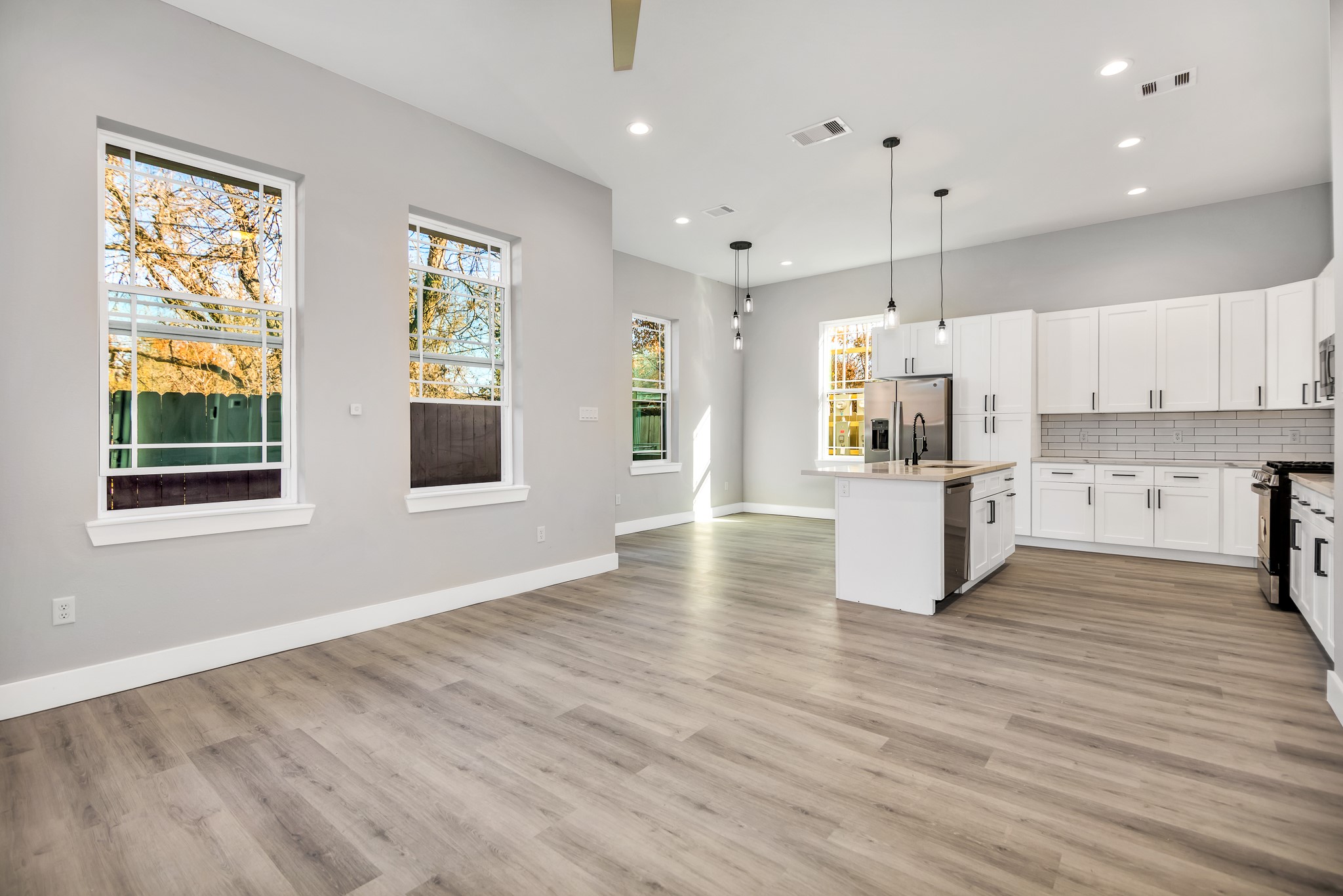 a view of kitchen with wooden floor and window