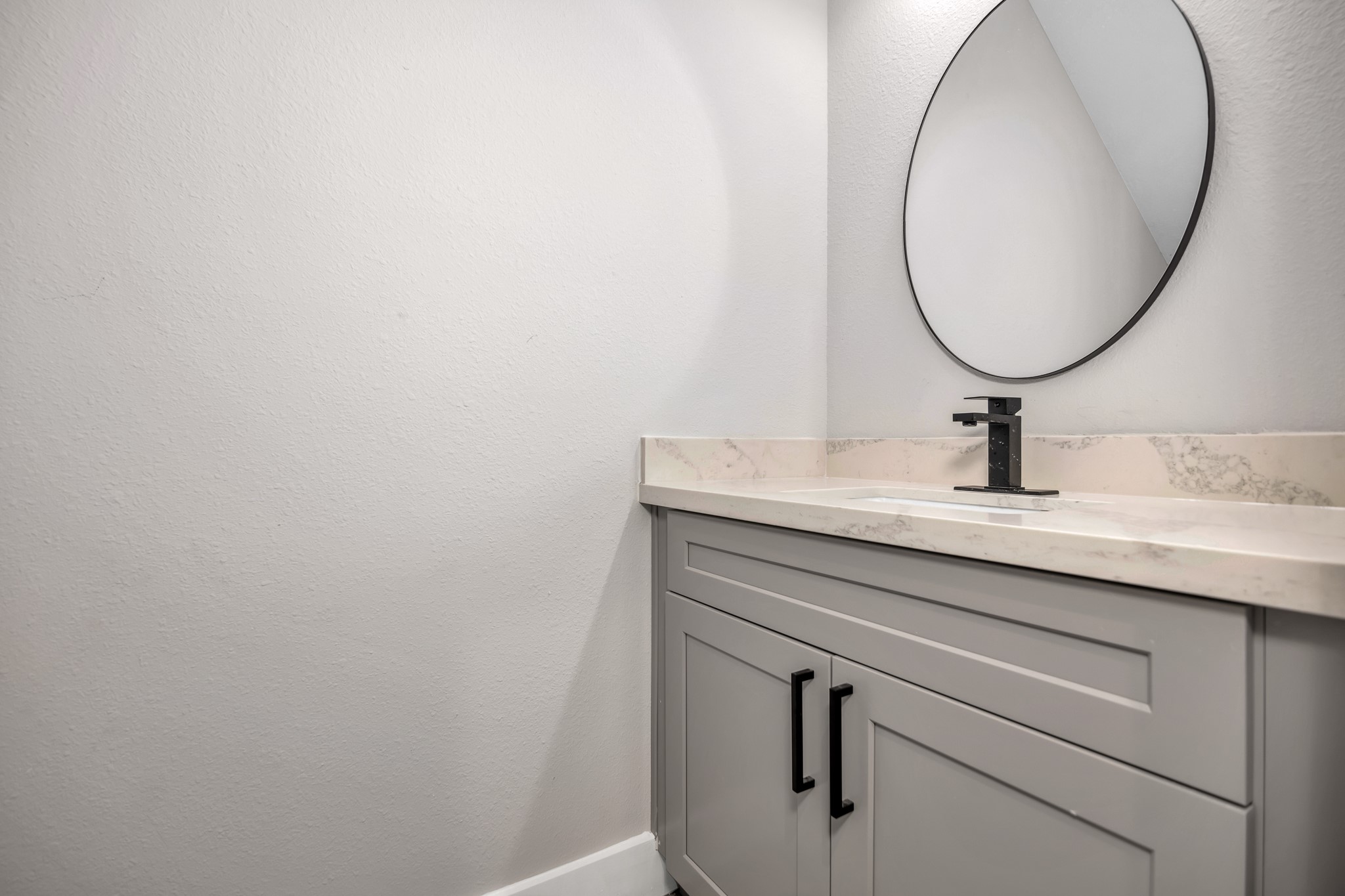 4924 Winnetka Street, Unit A Houston, TX 77021 - Photo 13 of 26 a bathroom with a sink and mirror